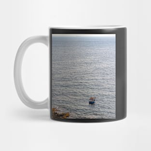 Lonely boat floating on the Mediterranean sea Mug